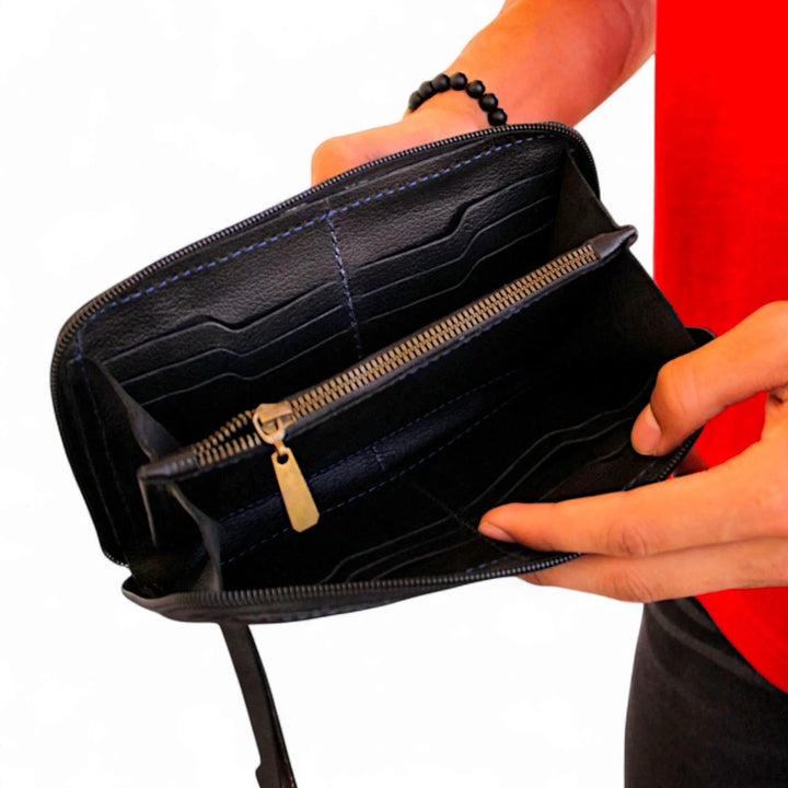 شنطة يد رجالي أنيقة من الجلد الطبيعي – متعددة الاستخدام بيد ثابتة وقابلة للإزالة.