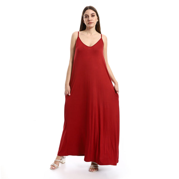Women's long dress with thin straps and side pockets