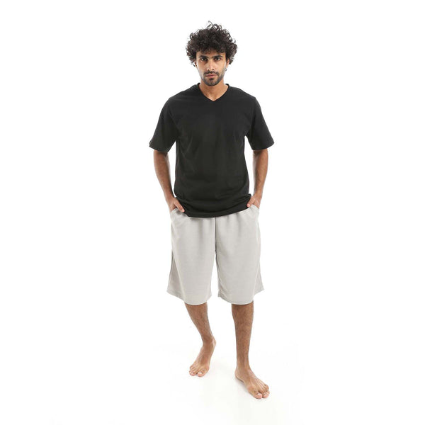 Men's stylish V-neck pajama set with shorts, made from 100% cotton.