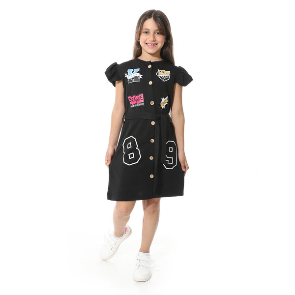 Girls' dress with a front print, elegant design with buttons and a belt at the waist.