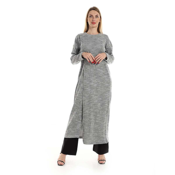 Women's knitted tunic with long sleeves and side buttons